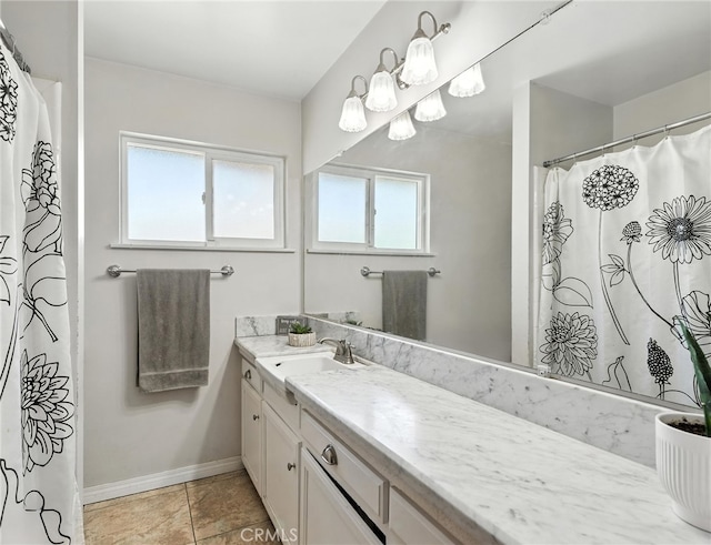 4220 Monticello Ave, Riverside, CA 92503 - full bath featuring vanity, tile patterned floors, and a shower with shower curtain
