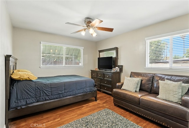 4220 Monticello Ave, Riverside, CA 92503 - bedroom with wood finished floors, multiple windows, and a ceiling fan