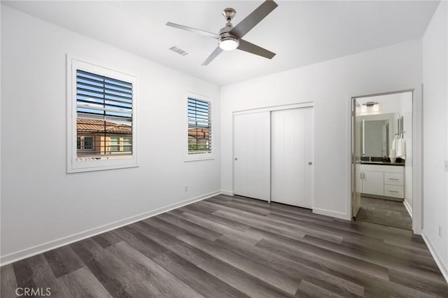 26 Prominence, Lake Forest, CA 92630 - unfurnished bedroom with dark wood-style flooring, a closet, ensuite bath, and a ceiling fan