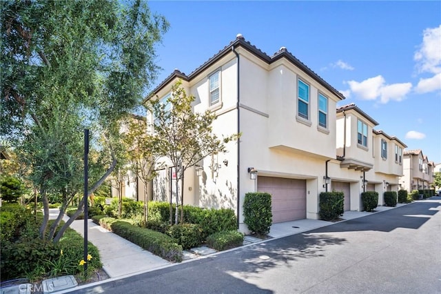 26 Prominence, Lake Forest, CA 92630 - view of building exterior featuring a garage and a residential view