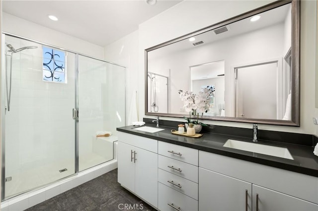 26 Prominence, Lake Forest, CA 92630 - bathroom featuring double vanity, a shower stall, and recessed lighting