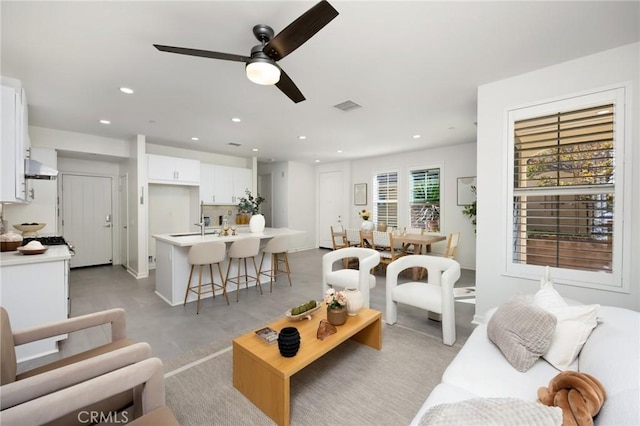 26 Prominence, Lake Forest, CA 92630 - living room with a ceiling fan, recessed lighting, and concrete flooring