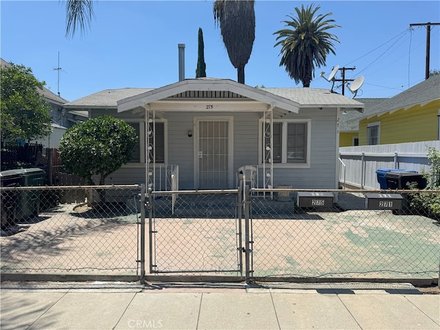 275 S Rebecca St, Pomona, CA 91766 - view of front facade with a gate and a fenced front yard