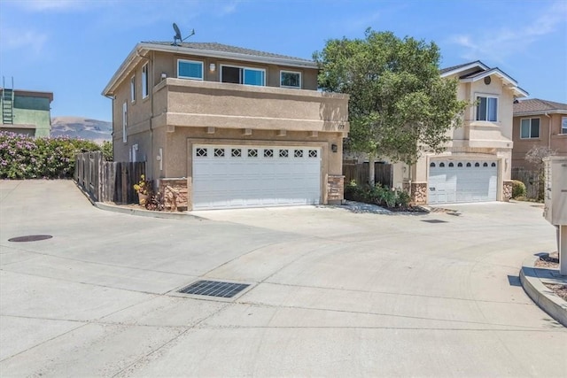 177 Jerome Ct, Nipomo, CA 93444 - view of front of house with a garage, concrete driveway, stucco siding, and stone siding