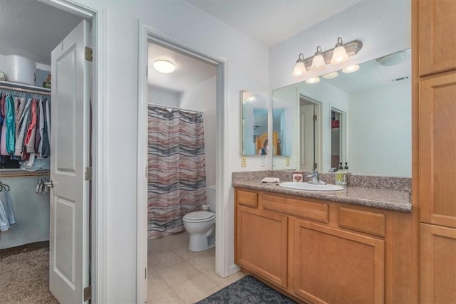 177 Jerome Ct, Nipomo, CA 93444 - bathroom featuring vanity, a walk in closet, curtained shower, and tile patterned floors