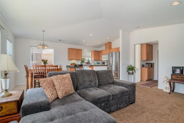 177 Jerome Ct, Nipomo, CA 93444 - living room with light colored carpet, lofted ceiling, a chandelier, and recessed lighting