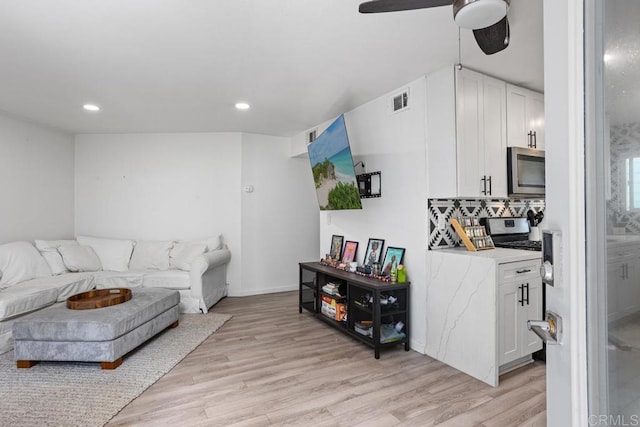 803 S Pacific St Unit 1, Oceanside, CA 92054 - living area with light wood-style floors, recessed lighting, and ceiling fan