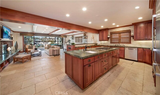 3908 Channel Pl, Newport Beach, CA 92663 - kitchen featuring stainless steel appliances, stone tile floors, open floor plan, recessed lighting, and tasteful backsplash