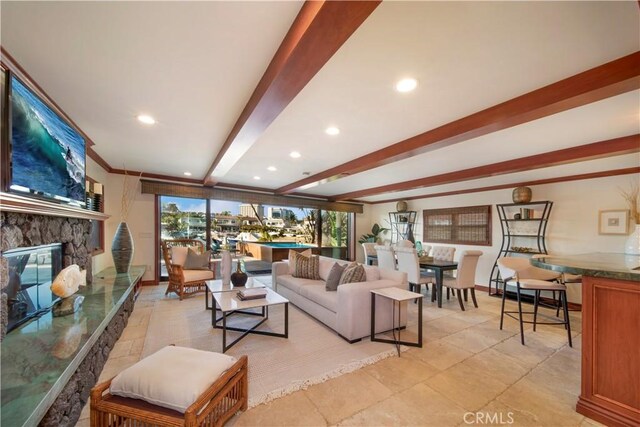 3908 Channel Pl, Newport Beach, CA 92663 - living area featuring beam ceiling, a stone fireplace, and recessed lighting