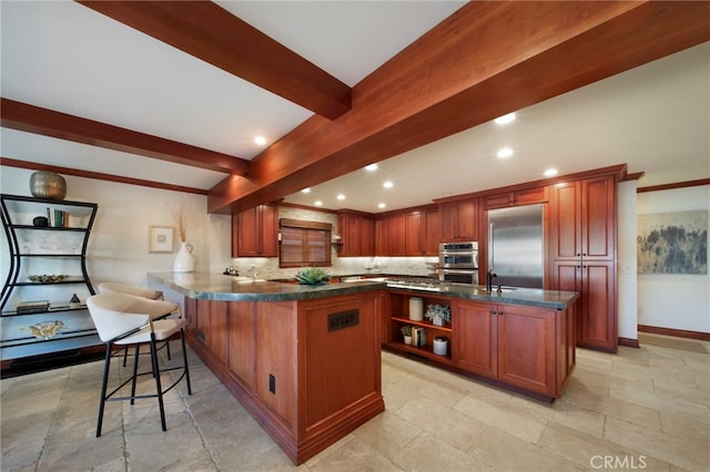 3908 Channel Pl, Newport Beach, CA 92663 - kitchen with stainless steel appliances, dark countertops, beamed ceiling, a peninsula, and open shelves