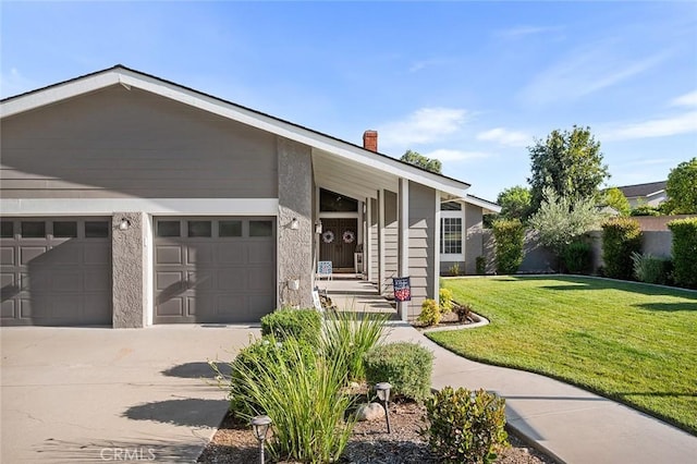 1092 Deborah St, Upland, CA 91784 - view of front of property with concrete driveway, a garage, a front lawn, and a chimney