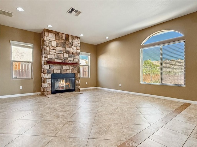 57466 Buena Suerte Rd, Yucca Valley, CA 92284 - unfurnished living room featuring a stone fireplace, tile patterned flooring, and recessed lighting