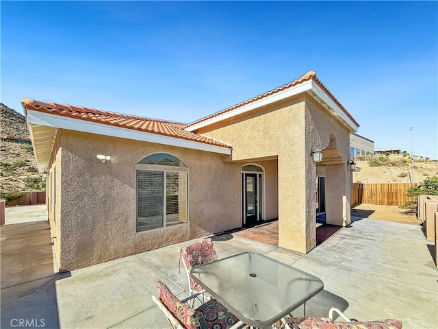 57466 Buena Suerte Rd, Yucca Valley, CA 92284 - rear view of property featuring a patio area, stucco siding, and a tile roof