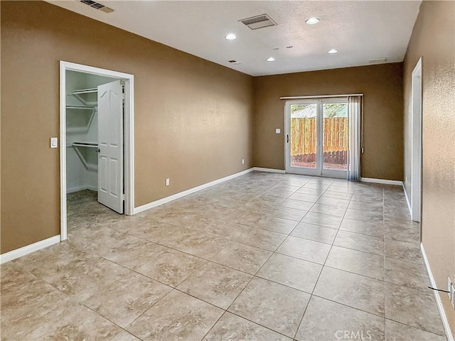 57466 Buena Suerte Rd, Yucca Valley, CA 92284 - empty room featuring light tile patterned floors and recessed lighting