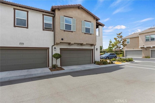 7020 Turin Pl, Eastvale, CA 92880 - view of property featuring a garage and stucco siding