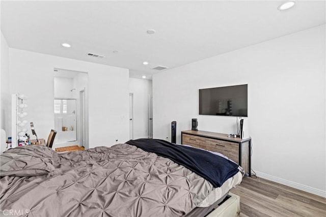 7020 Turin Pl, Eastvale, CA 92880 - bedroom with recessed lighting and light wood-type flooring