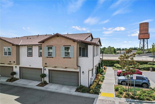 7020 Turin Pl, Eastvale, CA 92880 - view of property featuring a garage, stucco siding, driveway, and a tile roof