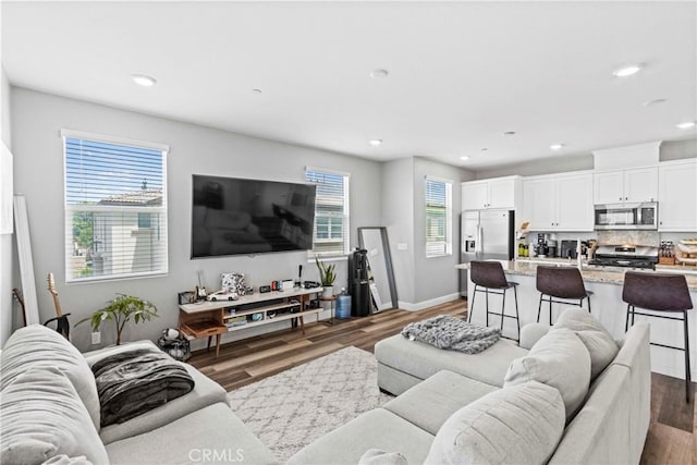 7020 Turin Pl, Eastvale, CA 92880 - living room with dark wood-type flooring and recessed lighting
