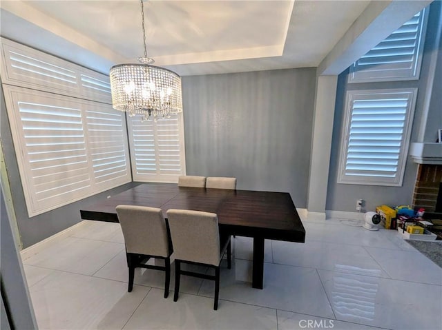 580 Hillsborough Way, Corona, CA 92879 - dining area featuring a chandelier, tile patterned floors, and a tray ceiling