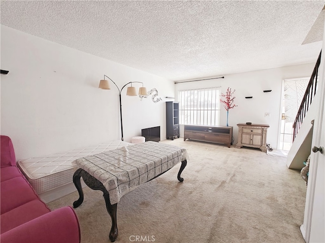 12836 12th St Unit 27, Chino, CA 91710 - bedroom with carpet flooring and a textured ceiling