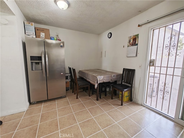 12836 12th St Unit 27, Chino, CA 91710 - dining space with a textured ceiling and light tile patterned floors