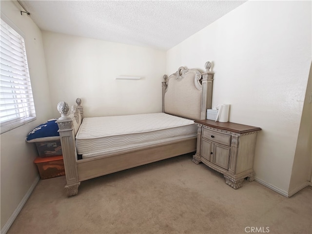12836 12th St Unit 27, Chino, CA 91710 - bedroom featuring light colored carpet and a textured ceiling