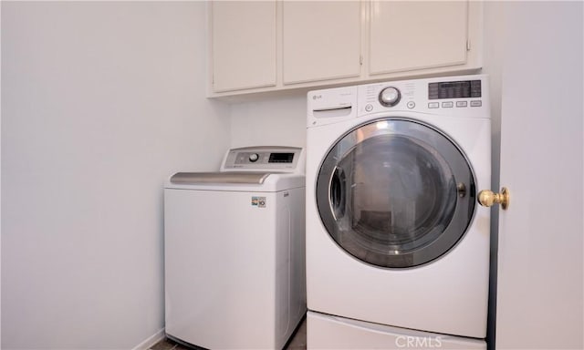 31995 Calle Ballentine, Temecula, CA 92592 - laundry area featuring washer and clothes dryer and cabinet space