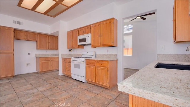 31995 Calle Ballentine, Temecula, CA 92592 - kitchen with white appliances and ceiling fan