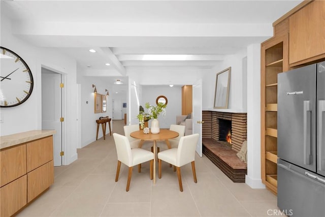 313 14th St, Seal Beach, CA 90740 - dining room featuring light tile patterned floors, recessed lighting, and a lit fireplace