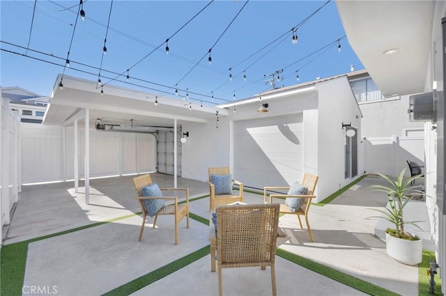 313 14th St, Seal Beach, CA 90740 - view of patio featuring an attached garage