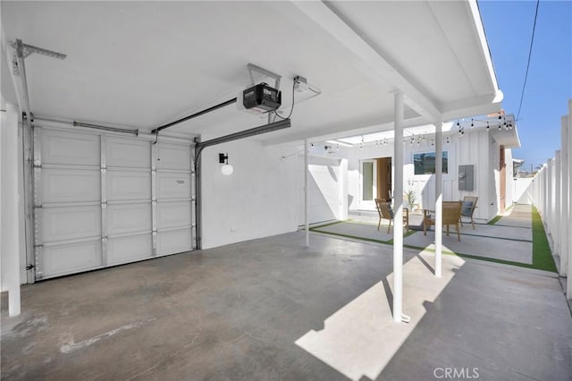 313 14th St, Seal Beach, CA 90740 - garage with a garage door opener and electric panel