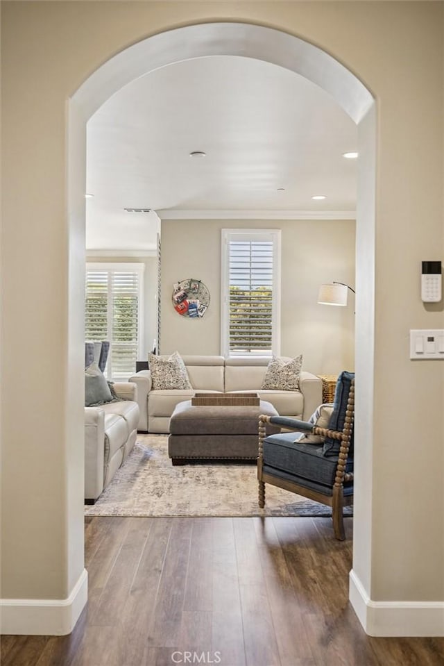 3032 Cortuna Dr, San Luis Obispo, CA 93401 - living area featuring arched walkways, wood finished floors, and crown molding
