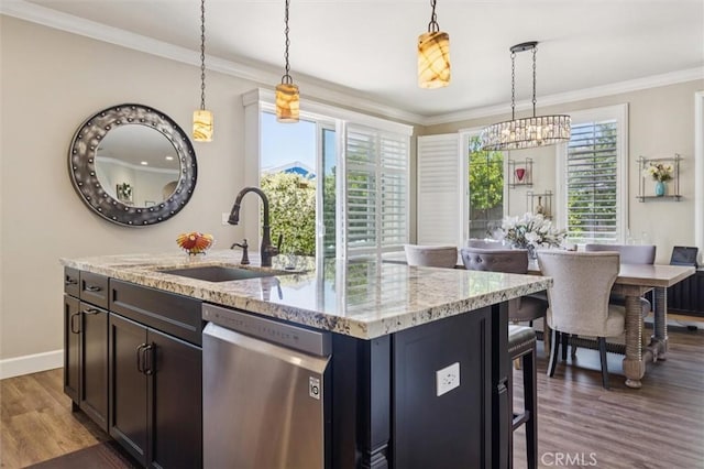 3032 Cortuna Dr, San Luis Obispo, CA 93401 - kitchen with stainless steel dishwasher, wood finished floors, a chandelier, light stone counters, and decorative light fixtures