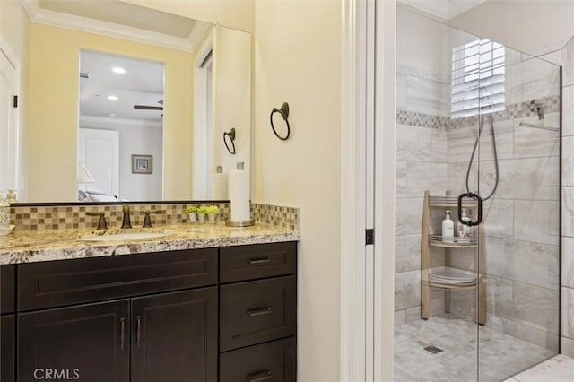 3032 Cortuna Dr, San Luis Obispo, CA 93401 - bathroom with a stall shower, vanity, crown molding, ceiling fan, and tasteful backsplash
