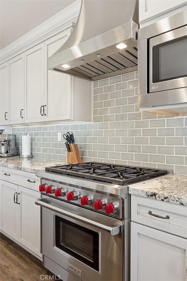 3032 Cortuna Dr, San Luis Obispo, CA 93401 - kitchen featuring appliances with stainless steel finishes, ventilation hood, white cabinets, and tasteful backsplash