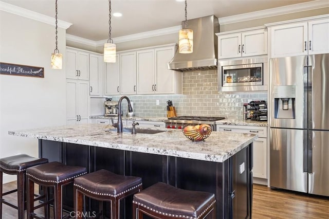 3032 Cortuna Dr, San Luis Obispo, CA 93401 - kitchen with stainless steel appliances, wall chimney exhaust hood, backsplash, wood finished floors, and crown molding