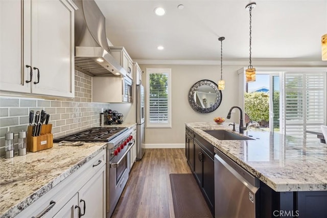 3032 Cortuna Dr, San Luis Obispo, CA 93401 - kitchen featuring stainless steel appliances, wall chimney exhaust hood, dark wood-style floors, decorative backsplash, and a kitchen island with sink