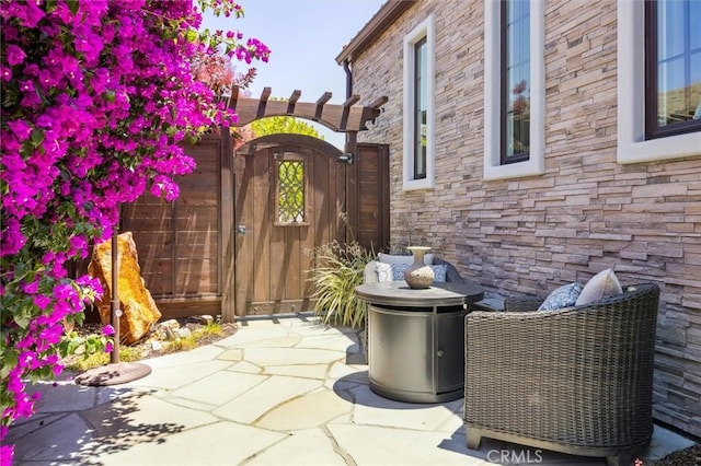 3032 Cortuna Dr, San Luis Obispo, CA 93401 - property entrance featuring stone siding and a patio area