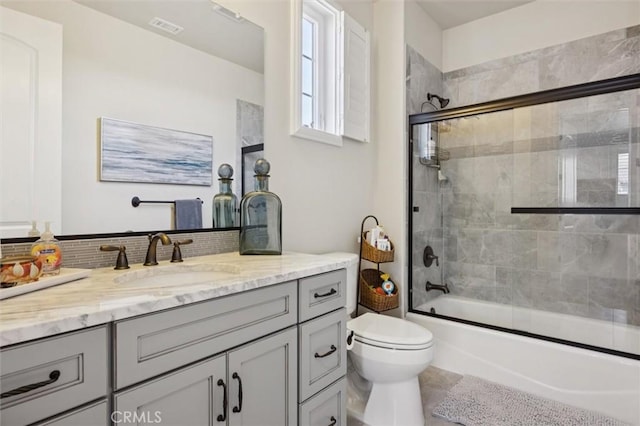 3032 Cortuna Dr, San Luis Obispo, CA 93401 - bathroom featuring vanity, bath / shower combo with glass door, and decorative backsplash