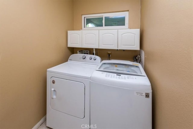 5709 Holly Ridge Dr, Camarillo, CA 93012 - laundry room with cabinet space and washer and clothes dryer