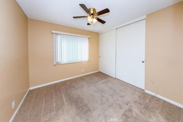 5709 Holly Ridge Dr, Camarillo, CA 93012 - unfurnished bedroom with carpet, a closet, a ceiling fan, and a textured ceiling