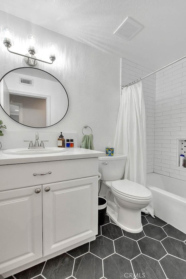 24 Edgebrook Dr, Phillips Ranch, CA 91766 - bathroom with vanity, shower / bath combination with curtain, a textured ceiling, a textured wall, and tile patterned flooring