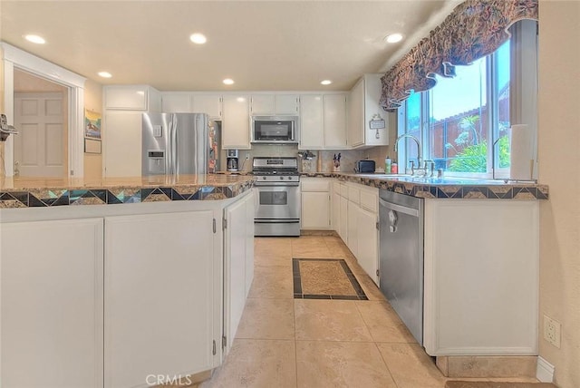 24 Edgebrook Dr, Phillips Ranch, CA 91766 - kitchen featuring stainless steel appliances, white cabinets, backsplash, recessed lighting, and dark countertops