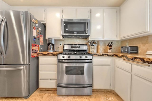 24 Edgebrook Dr, Phillips Ranch, CA 91766 - kitchen featuring appliances with stainless steel finishes, white cabinets, light tile patterned flooring, and backsplash