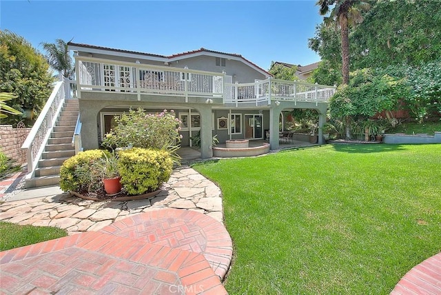 24 Edgebrook Dr, Phillips Ranch, CA 91766 - back of house with stucco siding, stairway, a yard, and a deck