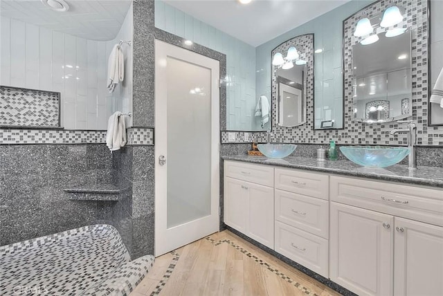 24 Edgebrook Dr, Phillips Ranch, CA 91766 - bathroom with a walk in shower, tasteful backsplash, and double vanity