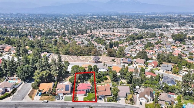24 Edgebrook Dr, Phillips Ranch, CA 91766 - aerial perspective of suburban area with property parcel outlined and mountains