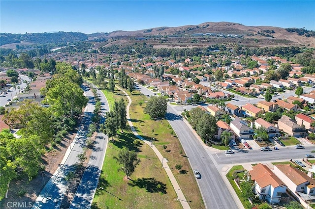 24 Edgebrook Dr, Phillips Ranch, CA 91766 - aerial overview of property's location with a mountain backdrop and nearby suburban area