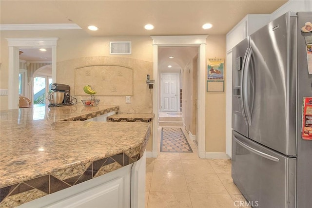 24 Edgebrook Dr, Phillips Ranch, CA 91766 - kitchen featuring stainless steel fridge, white cabinets, crown molding, light tile patterned floors, and recessed lighting