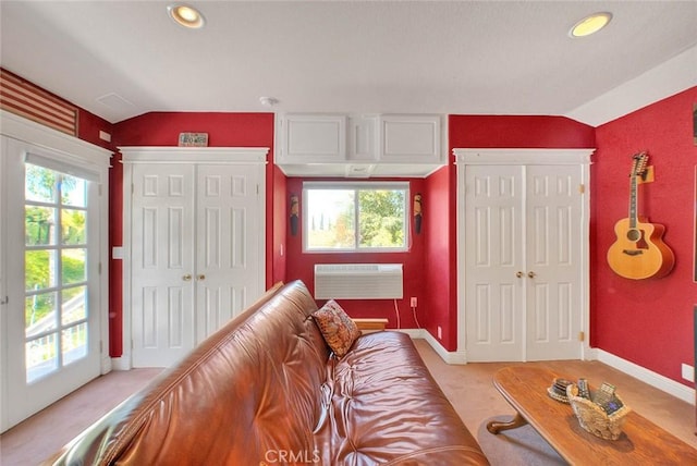 24 Edgebrook Dr, Phillips Ranch, CA 91766 - living area with a wall unit AC, light carpet, vaulted ceiling, and recessed lighting